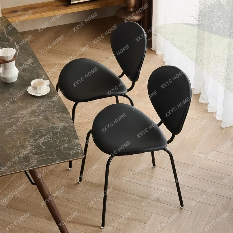 A Nordic modern simple wrought iron dining chair medium antique black leather restaurant backrest shell chair