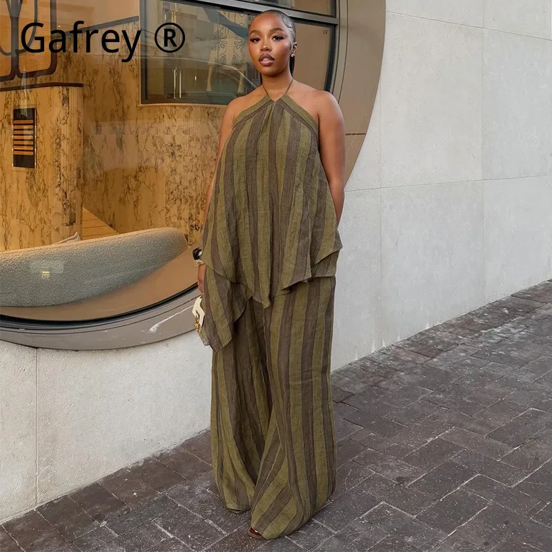 

Элегантный летний комплект 2026: шикарный асимметричный топ без рукавов с воротником-халтер и широкие брюки-палаццо. Модный комплект из двух предметов.