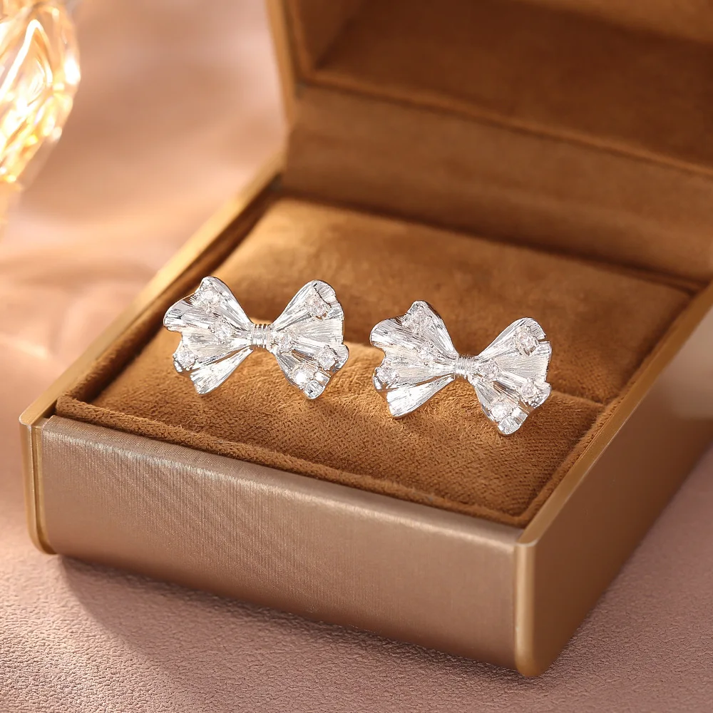 

Stylish and exquisite bow zircon earrings niche light luxury high-end design silver needle versatile commuting earrings