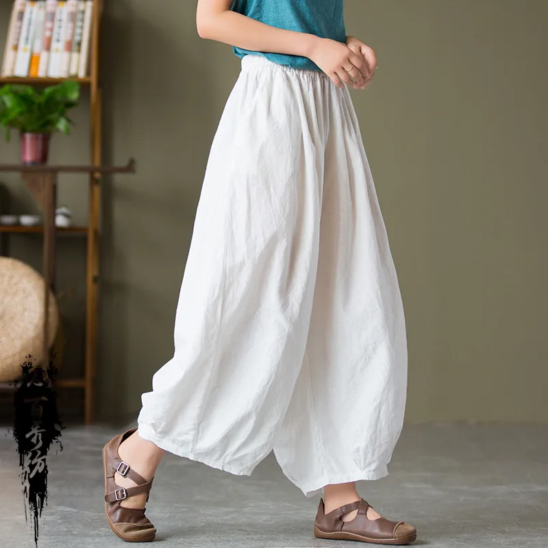 A/W stone-washed linen harem pants with an elastic waist and cropped ankle length for a relaxed fit.