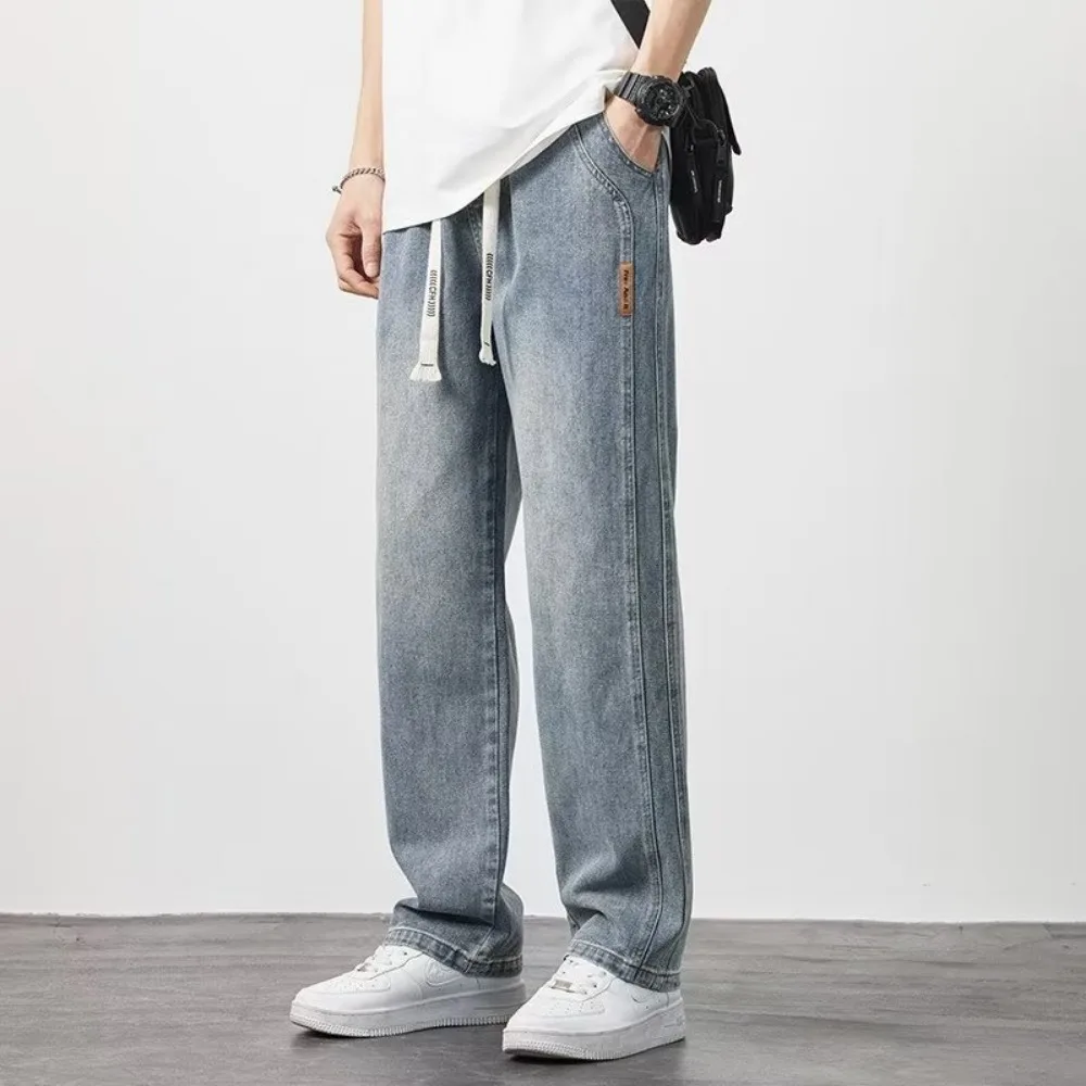 Nuovi pantaloni a gamba larga in Denim da uomo stile coreano Jeans larghi dritti Street Hip-hop pantaloni Casual da studente giornalieri nero grigio blu