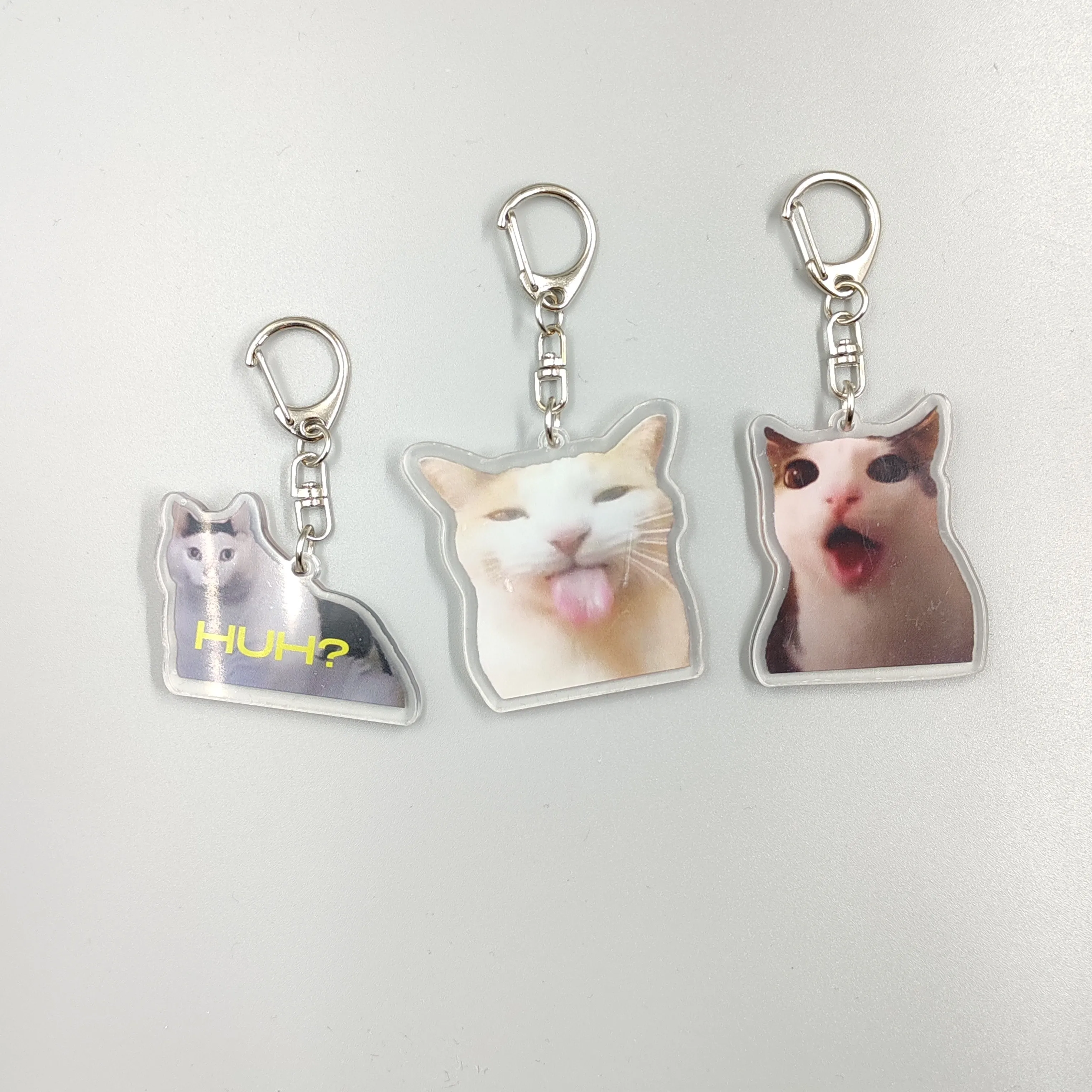 Viral Video Memes Series Of Keychains -huh Cat Confused Shocked Cat,cat Crunching, Also Known As crunchy Cat, cat Crunching, c