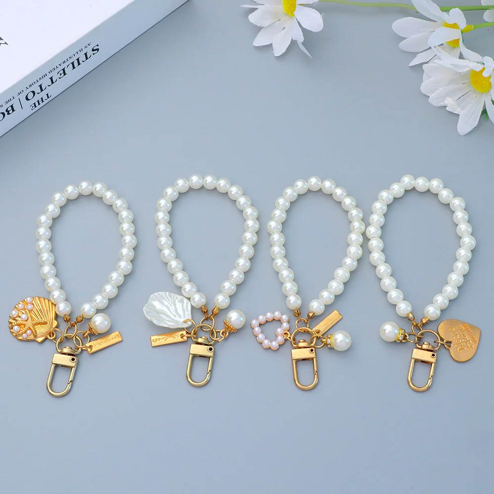 Lindo llavero de perlas para mujeres y niñas, concha de cuentas de perlas brillantes, bolso para teléfono, mochila, accesorio con dije, colgante de llavero de coche