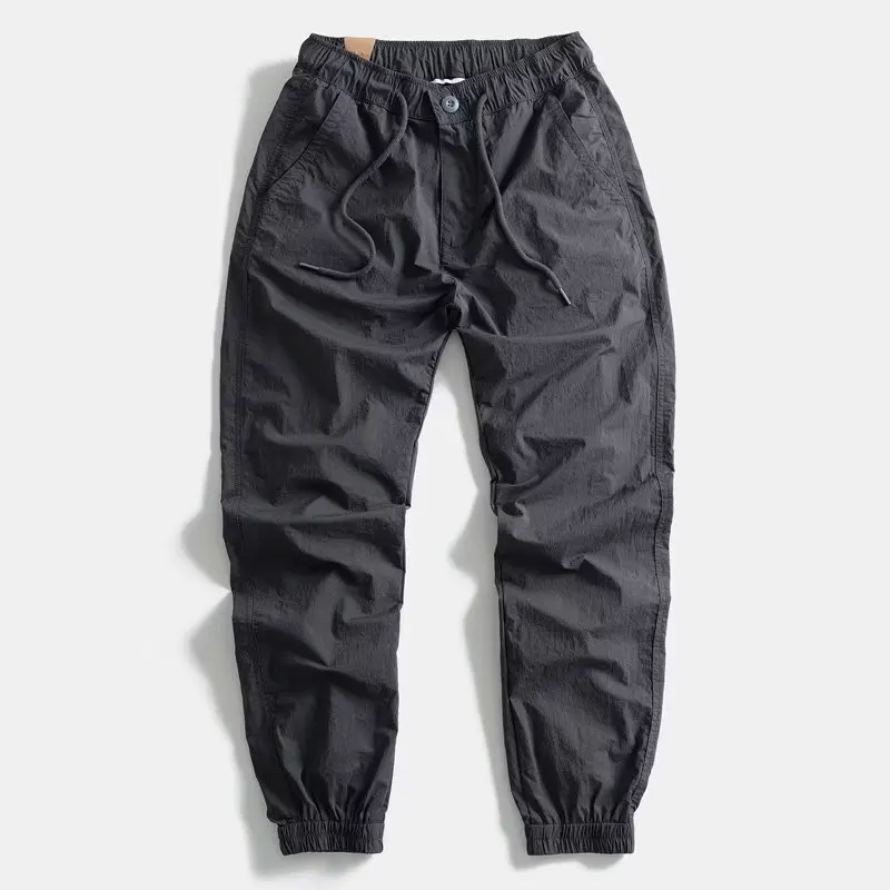 Pantaloni leggeri con risvolto elastico qui-dry Abbigliamento sportivo da uomo a vita sottile Abbigliamento da lavoro casual Protezione del lavoro Pantaloni lunghi resistenti all'usura