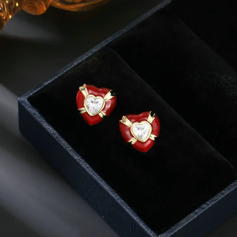 

The sweet and simple heart-shaped earrings with a niche design from Maillard Ankola feature red heart-shaped stud earrings