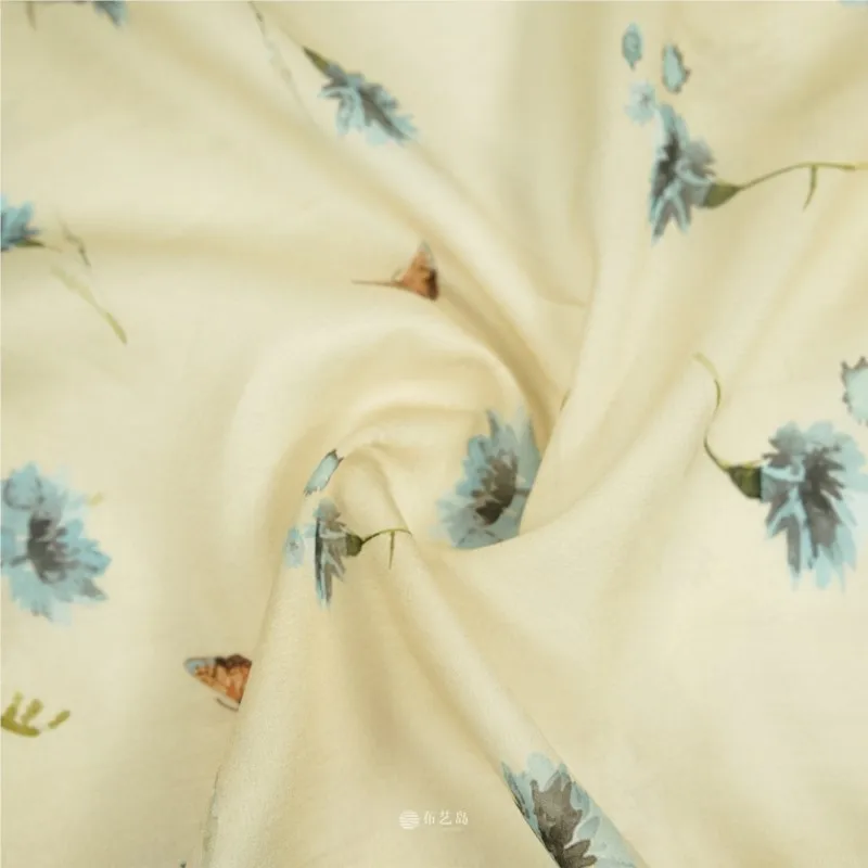 Semi-transparent and skin-friendly beige base blue cotton fabric for shirts dresses trousers cheongsam