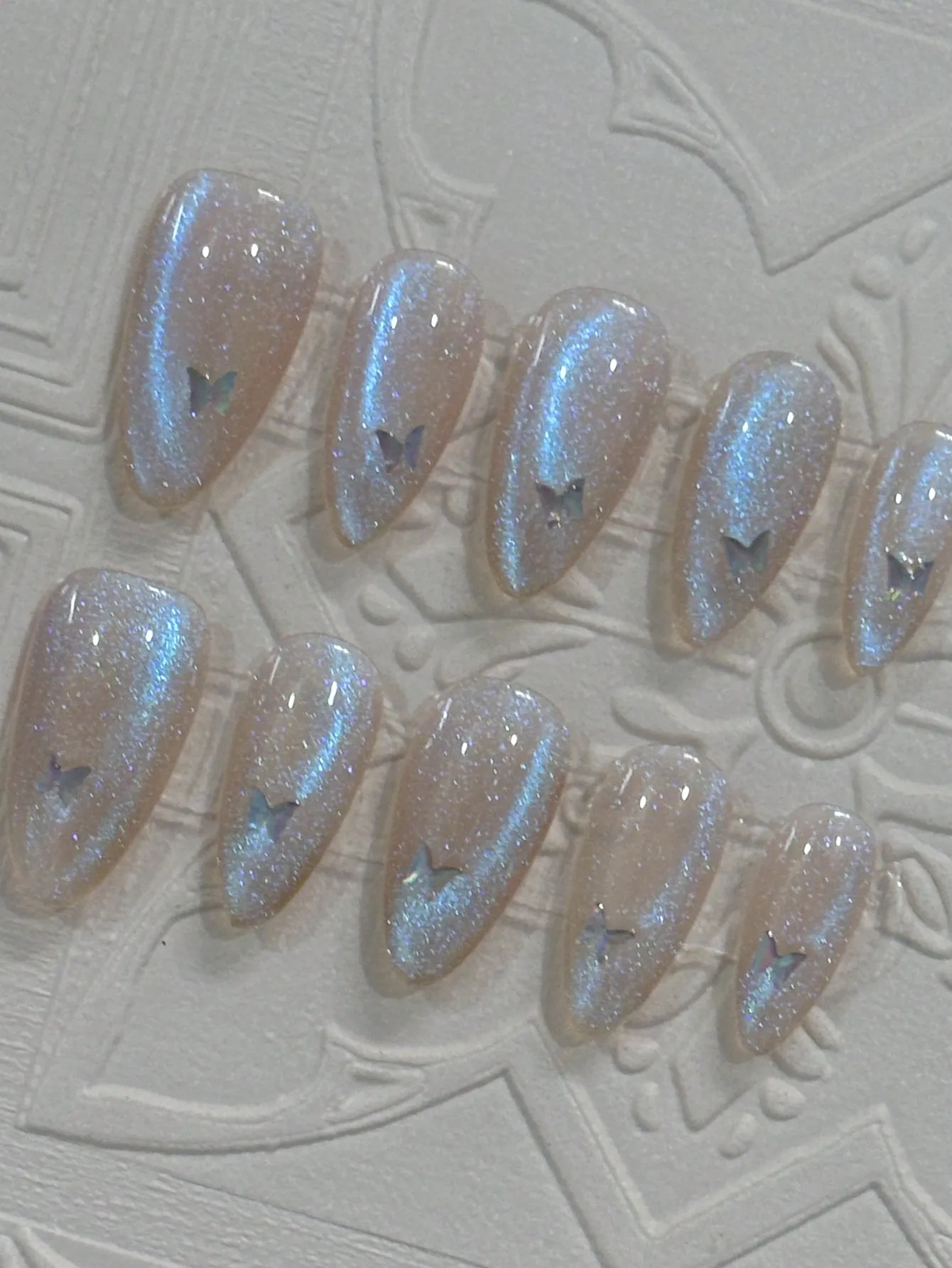 

10 pieces of pure handmade almond-shaped nails, blue cat's eye glittering and flashing butterfly sequins, blue tears, suitable f