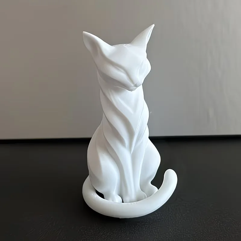 Figurine de chat élégante aux lignes gracieuses et à la forme sereine, idéale pour la décoration de bureau et l'embellissement de la maison