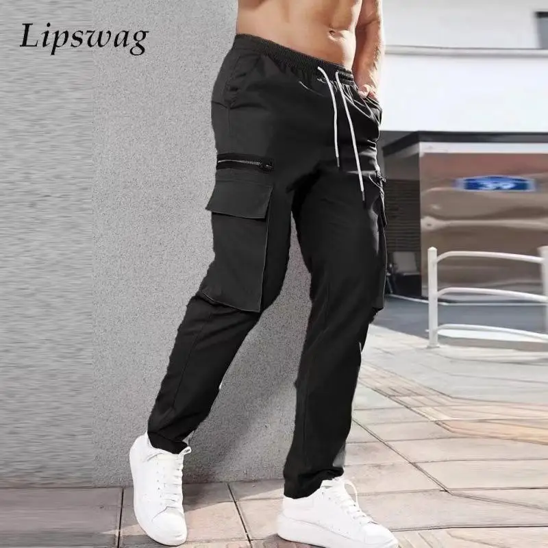 

New Spring Men's Solid Color Jogging Pants Slim Drawstring Cargo Pants Streetwear Men New Casual Patch Pockets Design Trousers