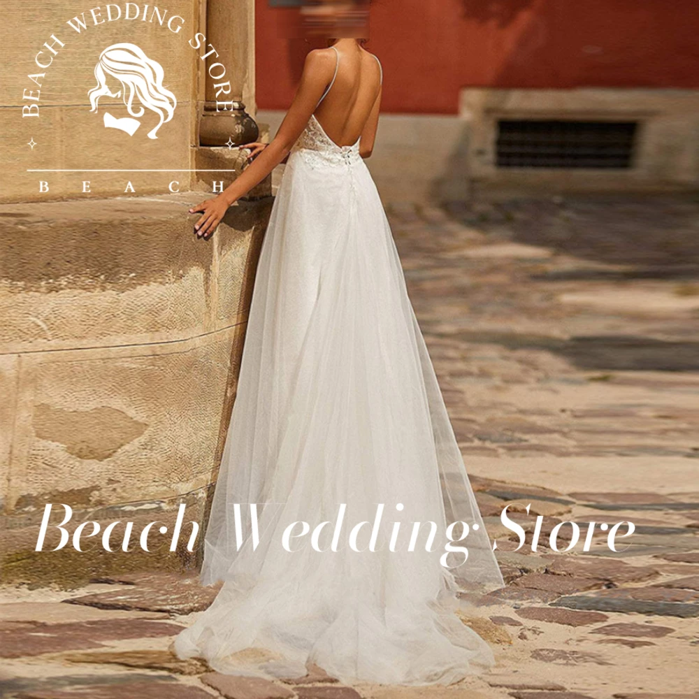 Abito da sposa sexy senza maniche personalizzato da spiaggia senza spalline applicazioni in pizzo che borda il treno senza schienale morbido tulle vestido