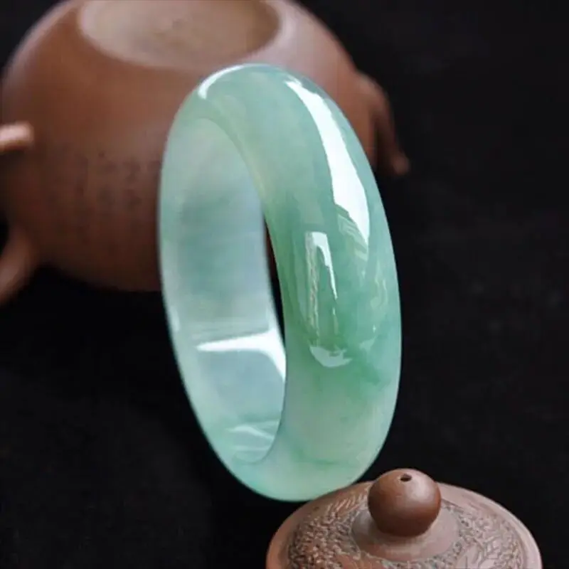 Myanmar natural jade bracelet, old mine, ice-type, light green, with oil-like inclusions, wider design, featuring floating patte view 3