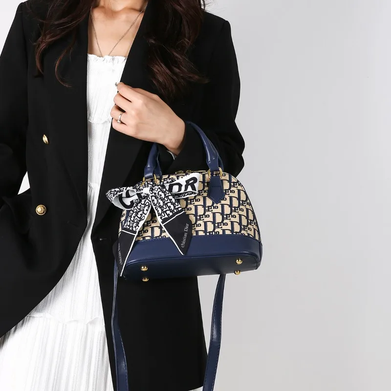 

Unique Vintage Handbag With Crossbody Strap Solid Color Paris Logo And Fashionable Minimalist Leather