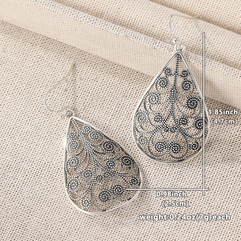 Vintage Silberfarbene Spiralförmige Hängeohrringe für Damen Metall Handgeschnitztes Hohlmuster für Party und Alltag – Detail 2