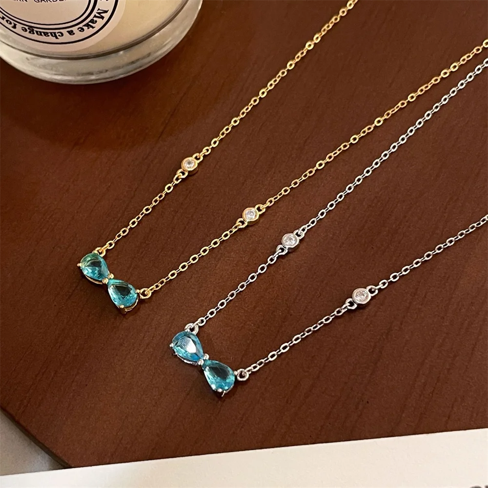 

Корейское романтическое сладкое ожерелье с ключицей, стерлинговое серебро S925, небесно-голубой бриллиантовый бант, нишевое ожерелье премиум-класса Vibe