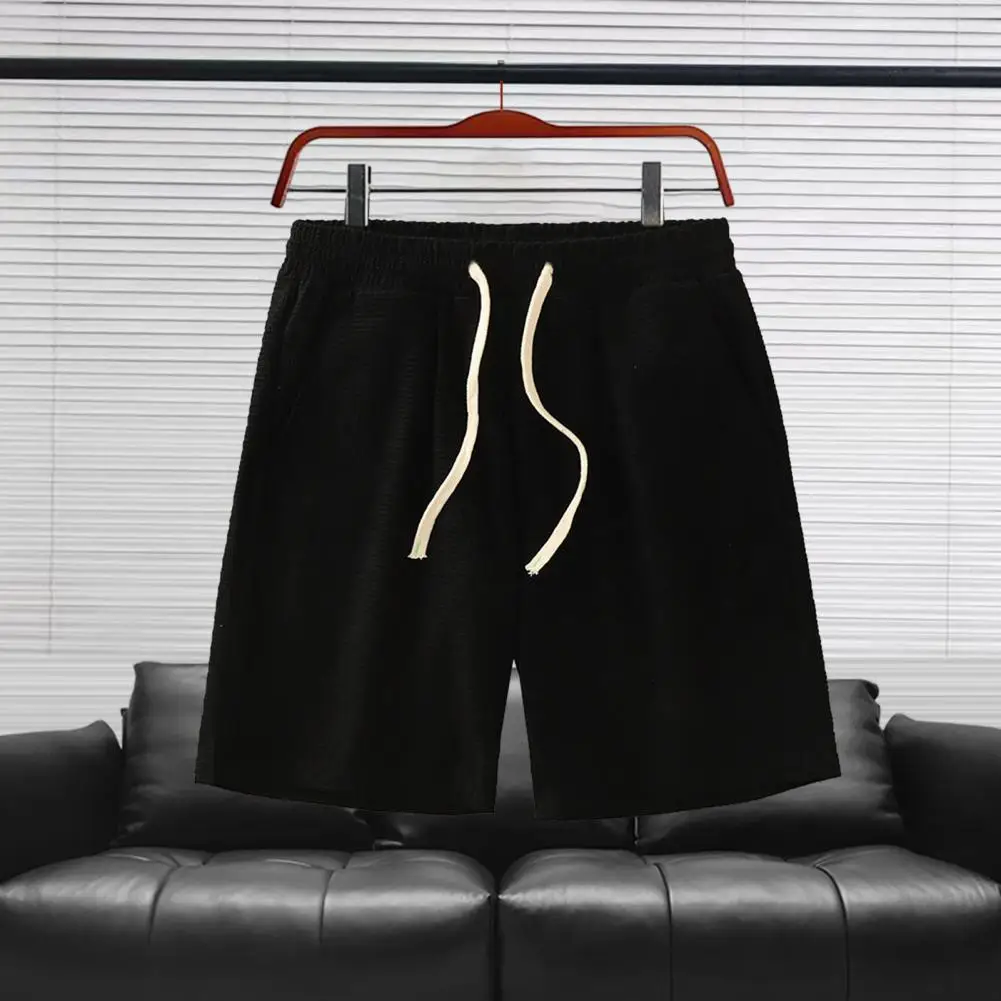 

Мужские шорты из вафельной ткани. Мужские шорты на талии с карманами. Однотонные повседневные шорты с карманами. Широкие короткие брюки.