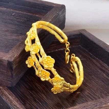 

Women's 24K Gold (AU999) Peach Blossom Bracelet | Liquid metal branch, gold-inlaid with bloom symbols