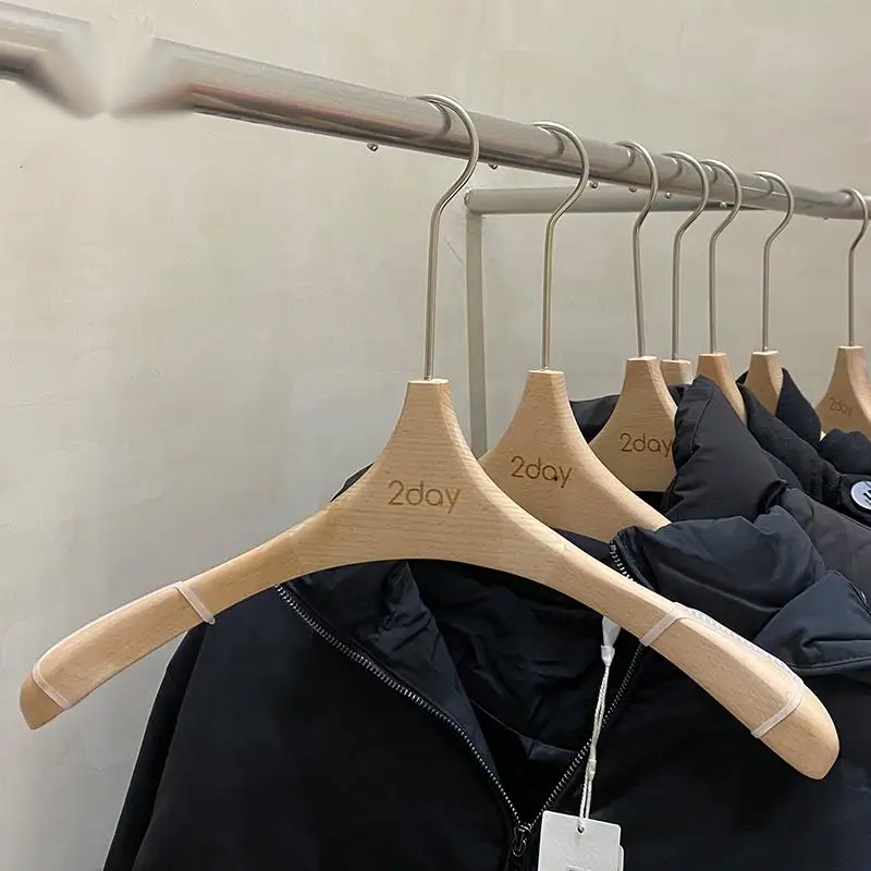 Clothing store hangers for women's, made of thick and wide beech wood, with seamless solid wood clothes hanging on the shoulders