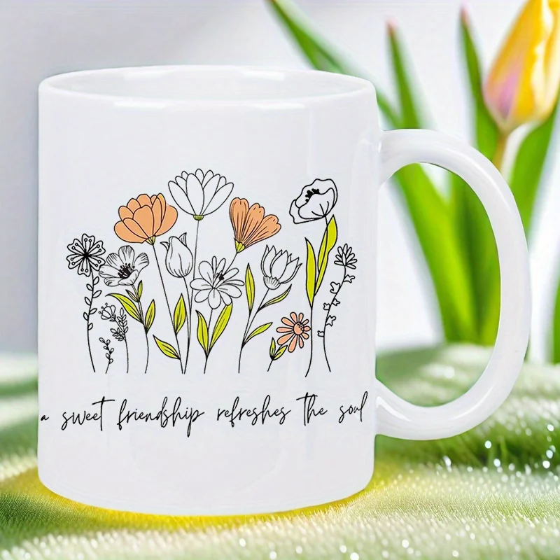 

Floral Friendship Refreshes Soul Ceramic Mug - White Coffee Cup with Vibrant Orange, White & Black Floral Design, Inspirational