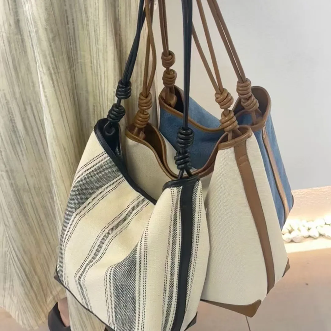 

2025 парусиновое ведро из воловьей кожи, большая вместительная сумка для матери и ребенка, новая универсальная тканая полосатая сумка на одно плечо