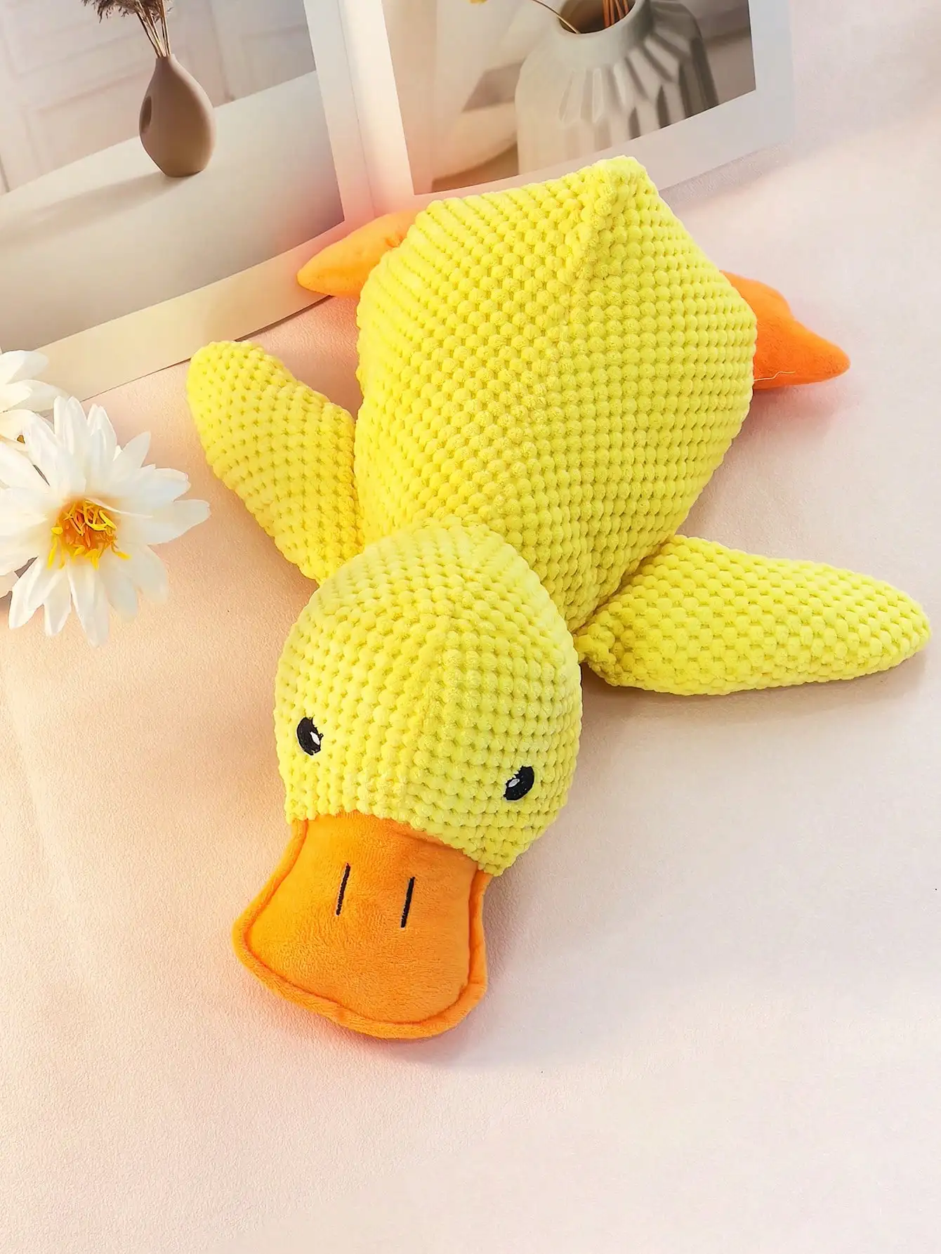 large, yellow, large duck pet stuffed toy that squashes and plays with the dog can be used as a pillow for pets only