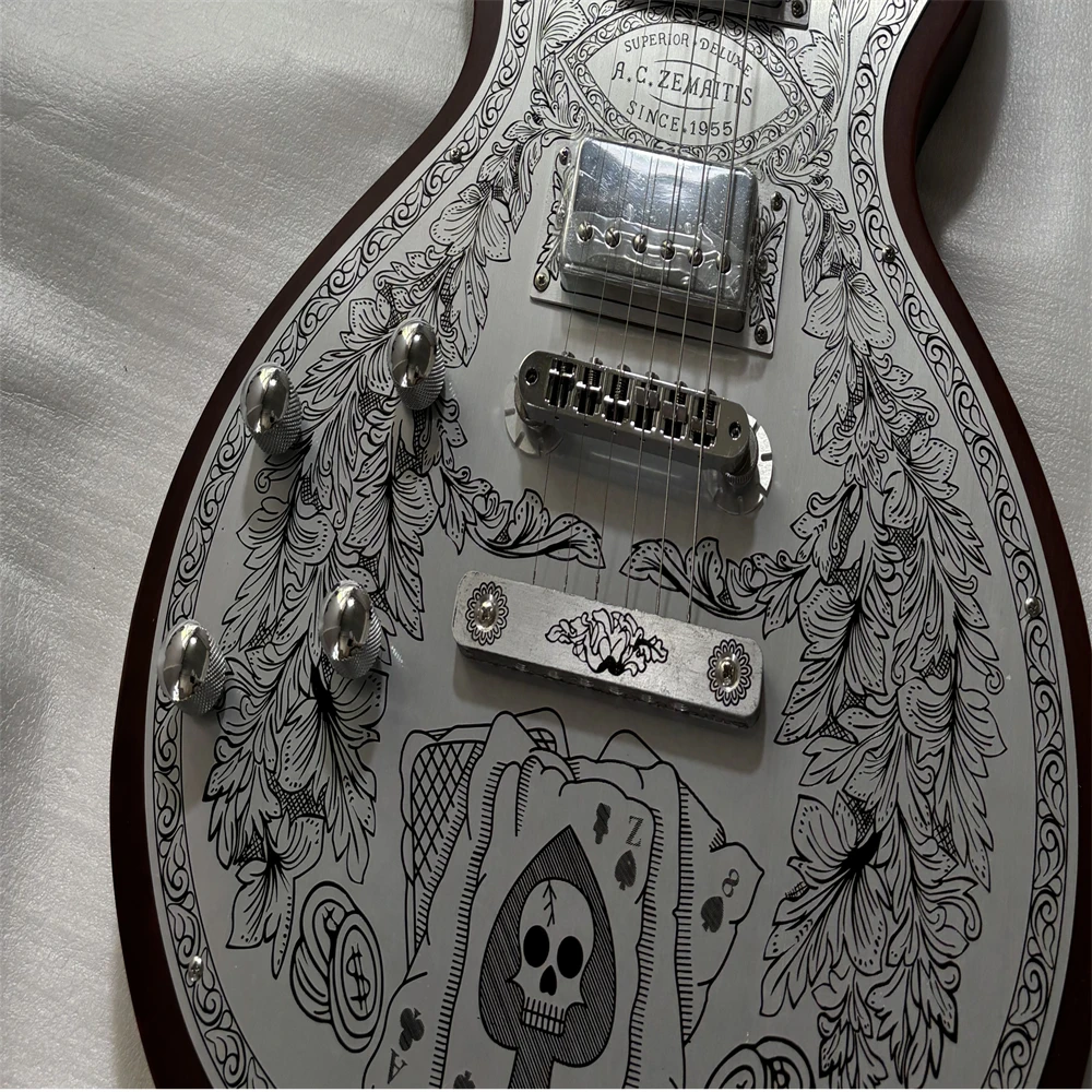 

Custom left-handed metal-panelled body electric guitar, with an aluminum body panel