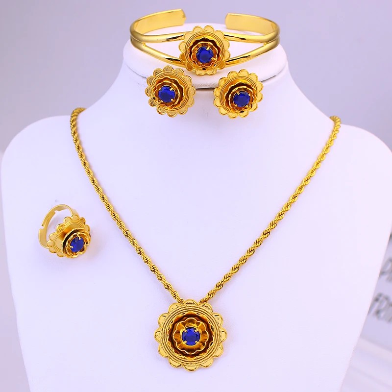 

Новый комплект украшений с эфиопским цветком и трехцветным камнем золотого цвета. Комплект украшений.