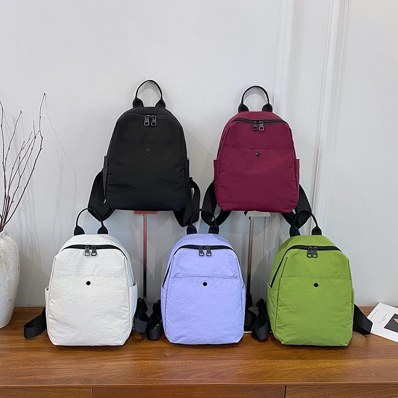 กระเป๋าเป้ไนลอนเกาหลีสำหรับผู้หญิง สีพื้นเรียบง่าย กระเป๋าเป้สะพายหลังขนาดเล็กสำหรับนักเรียนวัยรุ่น กระเป๋าเดินทาง กระเป๋าเป้สำหรับคุณแม่