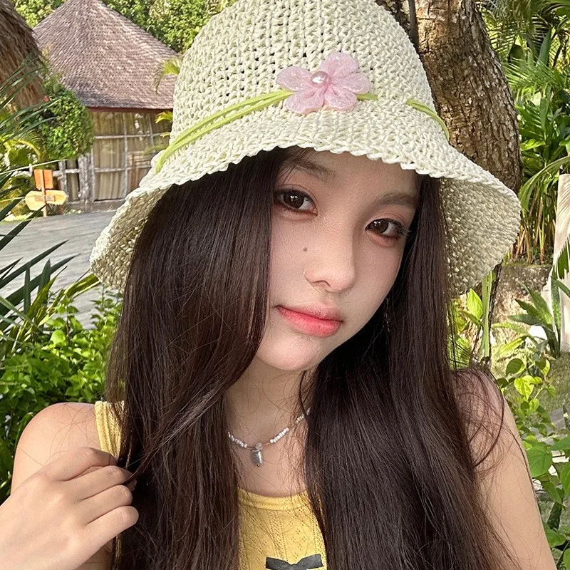 

A new woman's hat with hollowed-out flowers is going on vacation It has large brim for and fisherman's