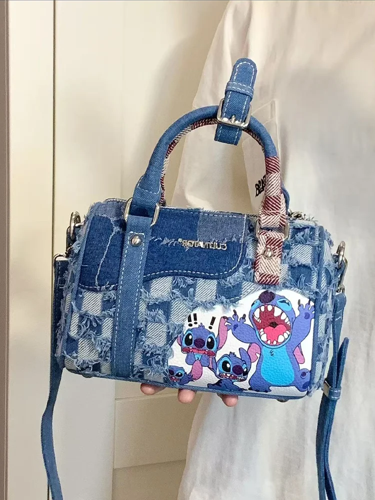 Zerrissene Denim-Tasche mit Cartoon-Stich, gespleißte diagonale Kreuztasche, handgehaltene Kissentasche, Denim-Boston-Tasche
