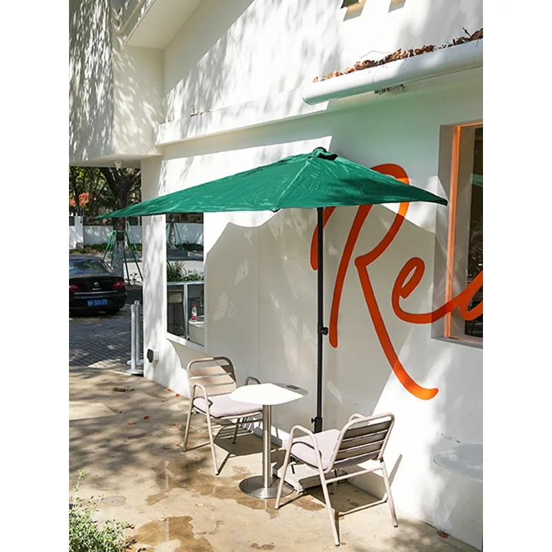 The height of the sunshade umbrella can be adjusted. Half of the outdoor courtyard umbrella is against the wall, and one side of