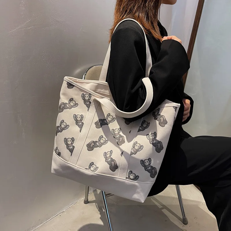

The fitting room with single shoulder bag canvas handbags niche joker tote bags large capacity students hand bag