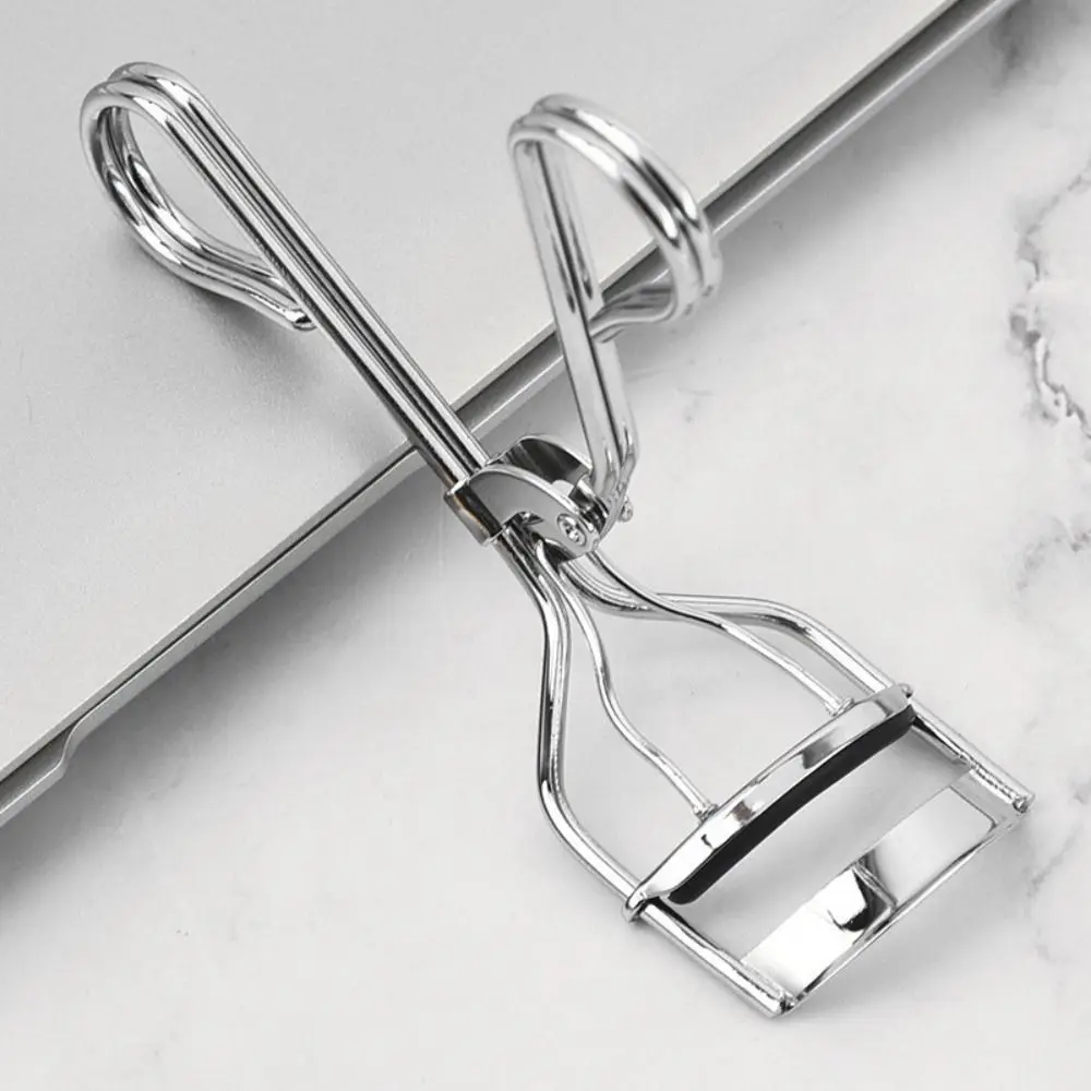 Piegaciglia tipo pressa in acciaio inossidabile Apertura liscia Maniglia ergonomica Clip per arricciare le ciglia Grandangolo di lunga durata