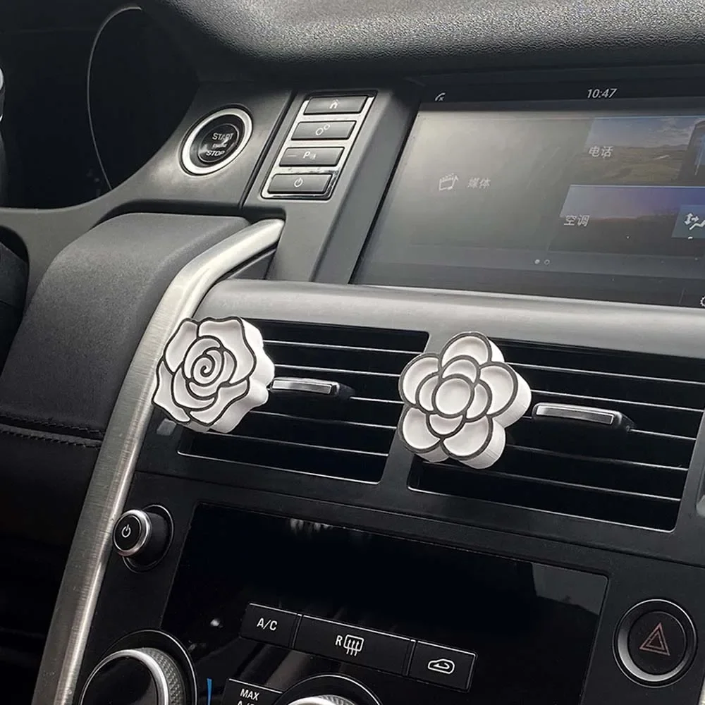 Juego de adornos aromáticos de Camelia montados en el coche, adornos aromáticos de salida de aire con aceite esencial de perfume para coche para eliminar el olor, 1 Uds.