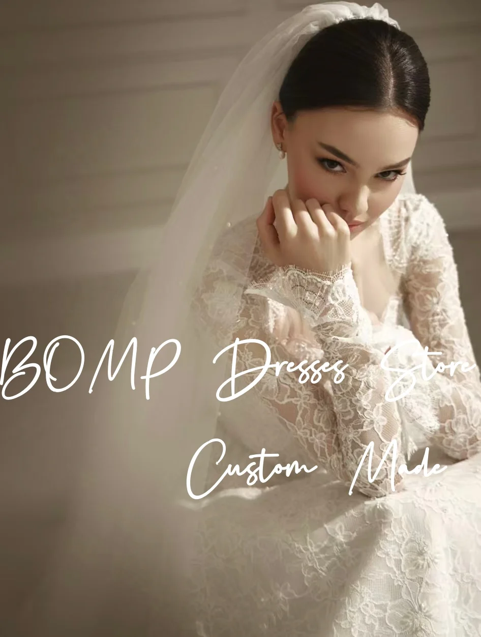 BOMP فستان زفاف فاخر من الدانتيل العاجي على شكل قلب وأكمام طويلة وأزرار ثنيات سويب تراين فستان زفاف مخصص رائع