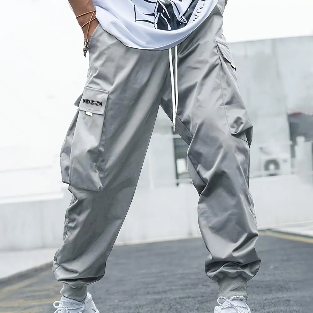 

Men Cargo Pants Flap Pocket Side Drawstring Waist Loose Ankle-banded Deep Crotch Hip Hop Streetwear Casual Trousers pantalones