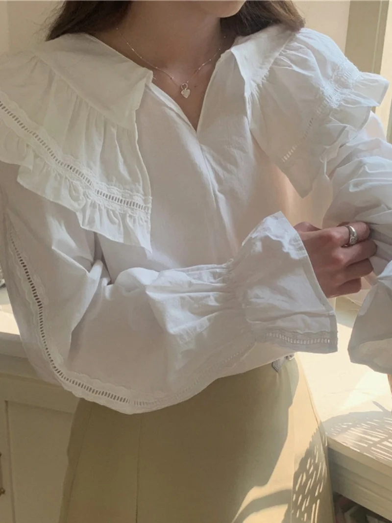 เสื้อแขนยาวทรงหลวมสไตล์เกาหลี คอระบายหวานๆ สำหรับผู้หญิง สีพื้น เหมาะกับฤดูใบไม้ผลิ ดีไซน์เก๋ไก๋ สไตล์ลำลอง แต่งผ้าต่อกัน