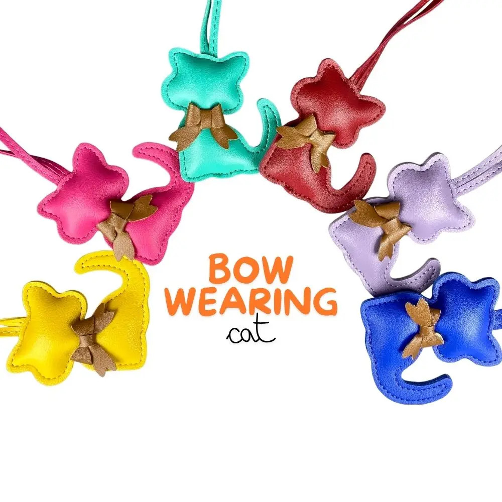 سلاسل مفاتيح مصنوعة يدويًا من الجلد على شكل قطة - تفاصيل ربطة عنق رائعة، 12 لونًا - هدية مثالية من جلد البولي يوريثان - مثالية لإكسسوارات الحقائب