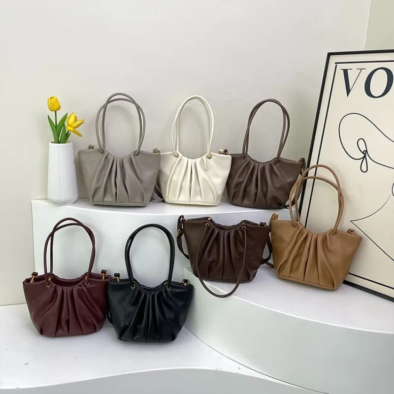 Einzigartige lässige Umhängetasche für Damen mit schlichtem Design und strukturiertem Leder, bietet großes Fassungsvermögen und eignet sich als schicke Wickeltasche.