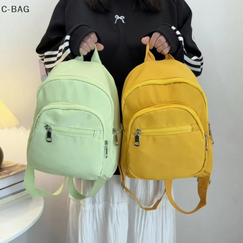 กระเป๋าเป้สะพายหลังขนาดเล็กสำหรับผู้หญิงอเนกประสงค์ กระเป๋าเดินทางน้ำหนักเบาขนาดกะทัดรัดพร้อมช่องใส่ของหลายช่อง