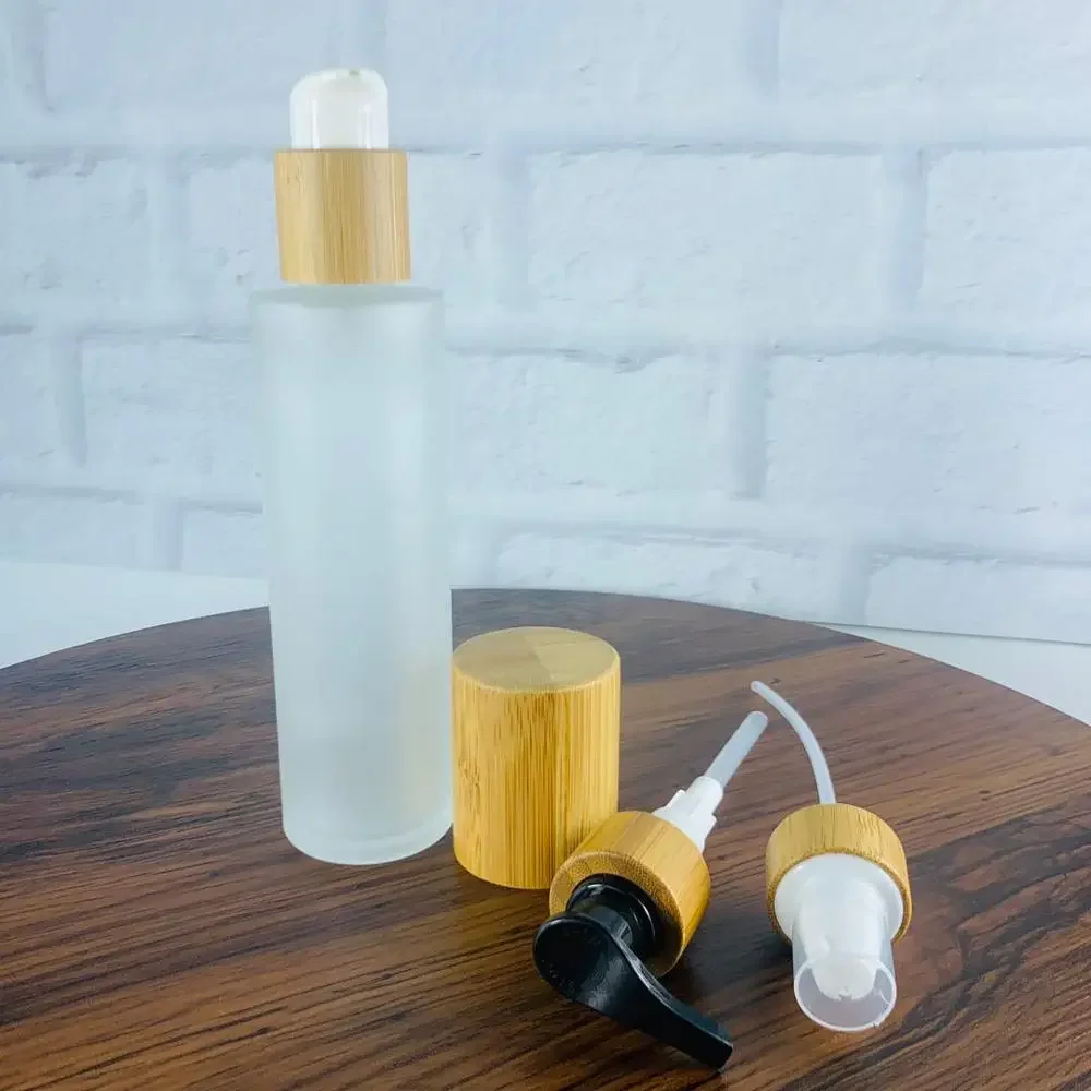 

Wholesale quality Frosted Glass Bottles with Bamboo Wood Lid Lotion Shampoo soap Pump Cap glass jar with lid Made In China
