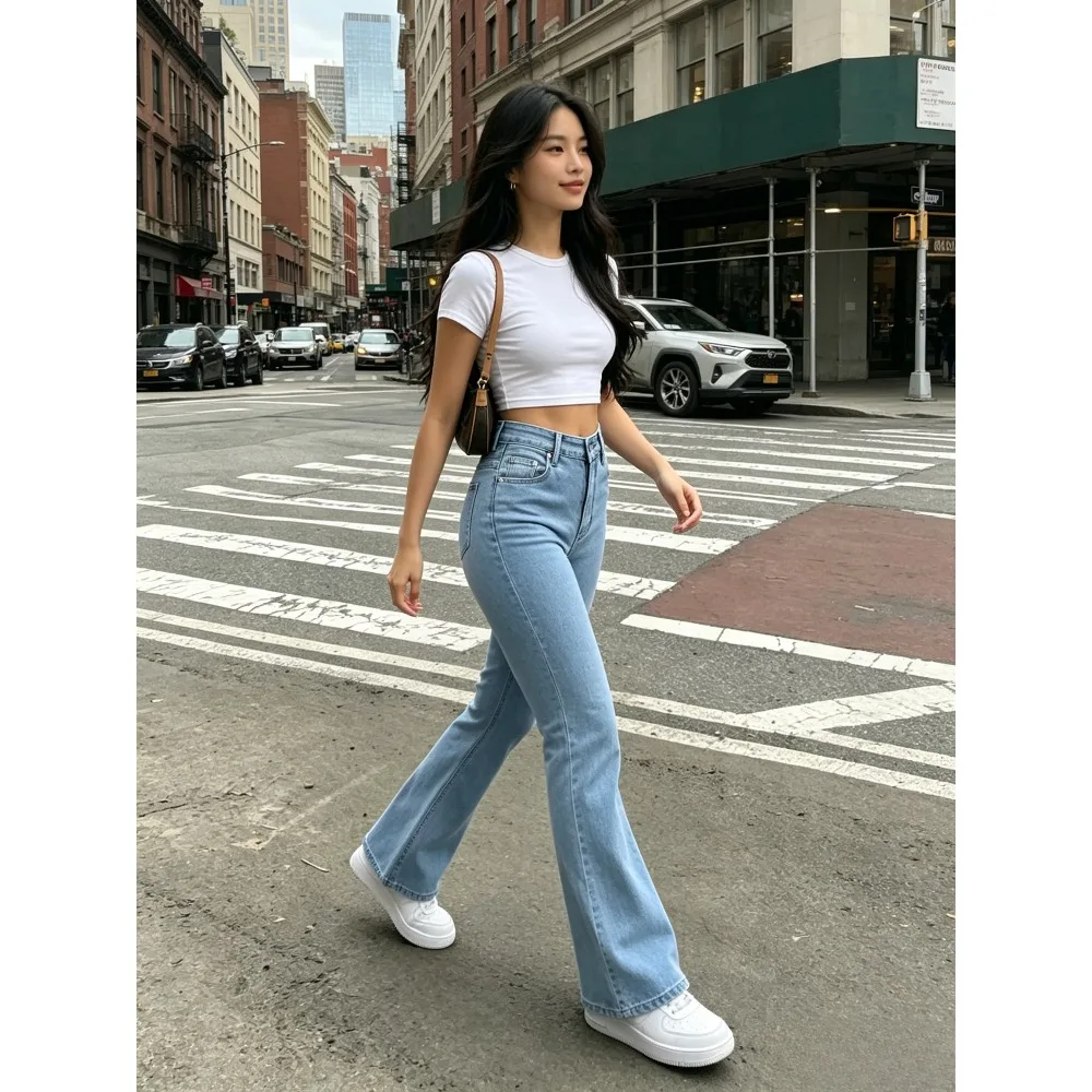 Slim, slim, light blue flat nail design, long legs, high hips and high elasticity, and versatile tight jeans bell bottoms.