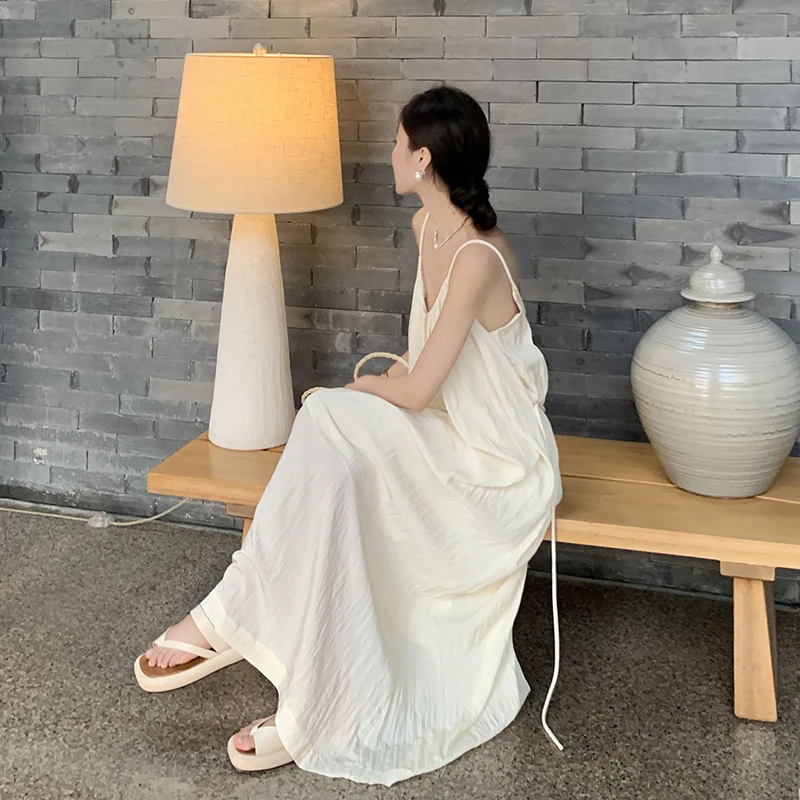 فستان طويل بدون ظهر للنساء لقضاء العطلات على الشاطئ، تصميم فضفاض، تنورة صيفية على شكل حرف A، ياقة مستديرة بدون أكمام