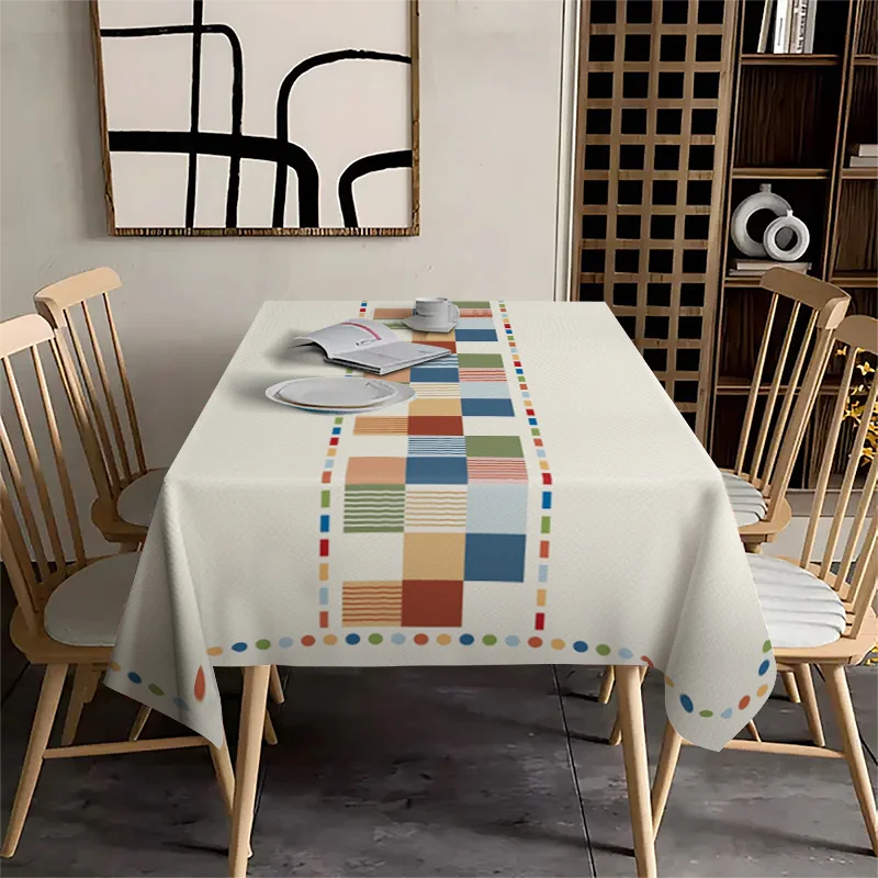 One interesting geometric color-block rectangular tablecloth, featuring contrasting patterns and multi-color patchwork designs.