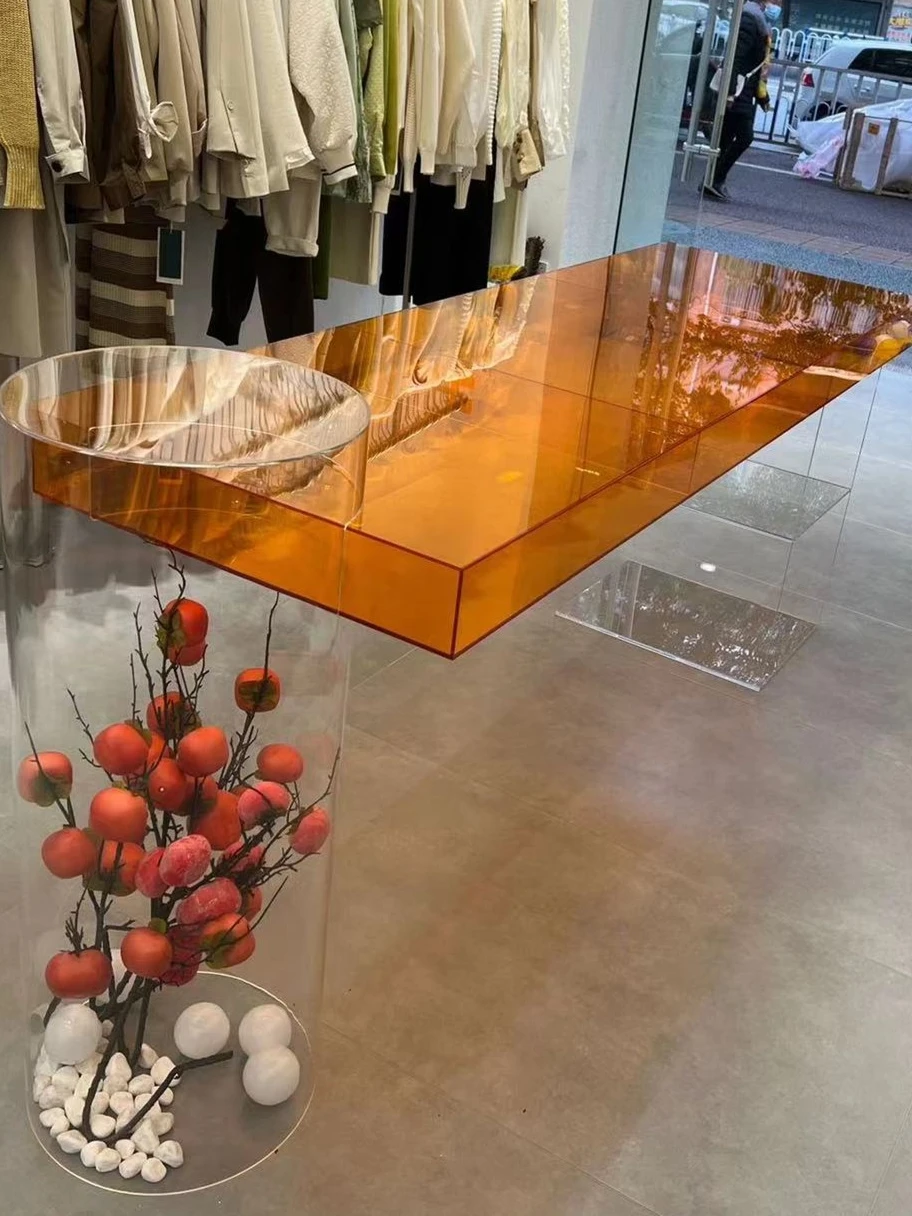 Acrylic display table in the middle cabinet clothing store display table