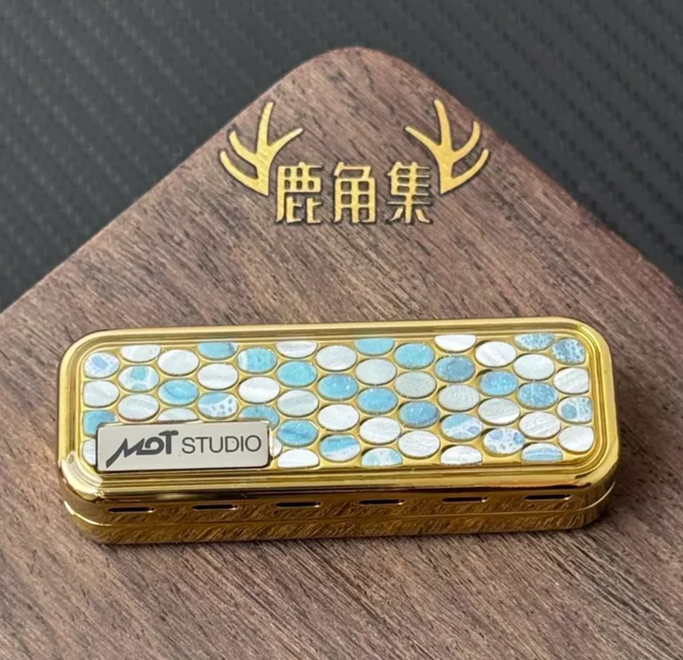 

Used EDC Mot Fengling+Sealed Crystal Steel Gold Plating fidget slider decompression toy