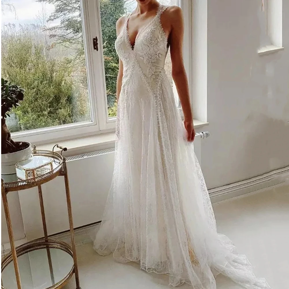 

Bohemian Lace Beach Wedding Dresses Sleeveless V-Neck Backless Sexy Summer Boho Bridal Gowns Beaded Appliques Long Tulle Vestido