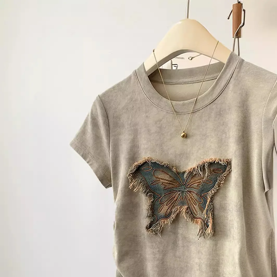 2025年夏の女性用半袖Tシャツ、スパイシーなガールデザインとウエストを締めるスリムフィットショートトップが特徴です