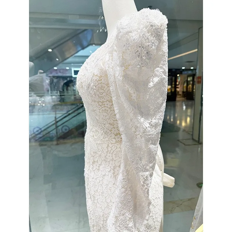 

The new light gauze lace long-sleeved welcome dress with a fishtail