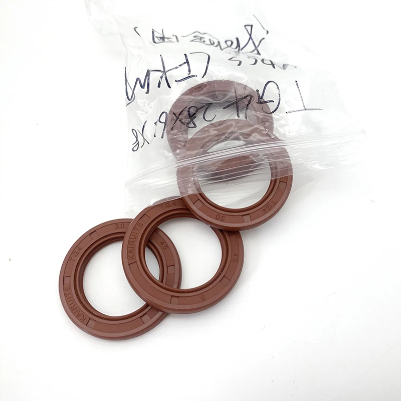 Seal ring berbahan fluororubber TG4, rangka/selempang oli, diameter dalam (ID) 25mm, diameter luar (OD) 32mm~62mm, bentuk bibir, seal berputar, tahan penuaan dan tahan ozon, berbahan FKM