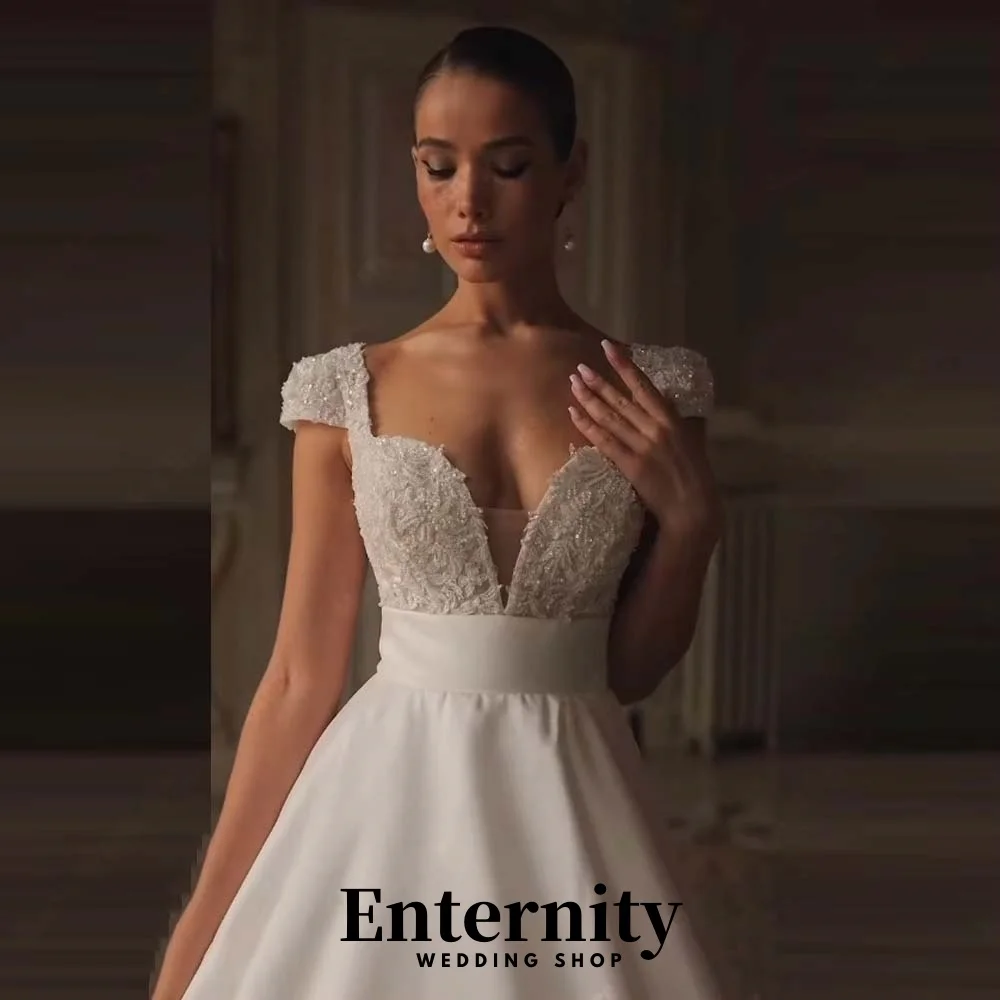 Maßgeschneidertes exquisites Kurzarm-Hochzeitskleid Charmantes V-Ausschnitt Sweep Zug Brautkleider Pailletten Brautkleid Vestidos De Noiva